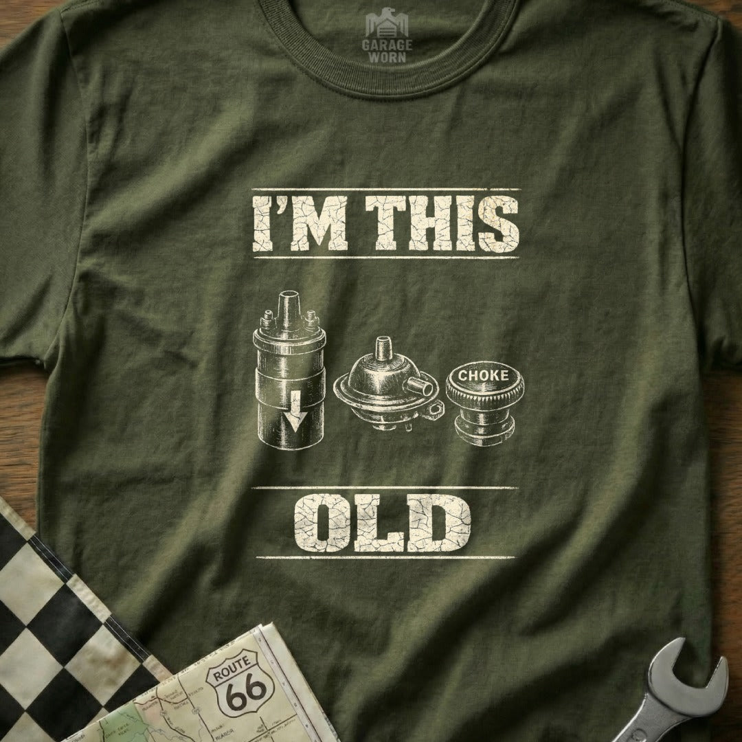 Green t-shirt with "I'm This Old" and images of car parts.