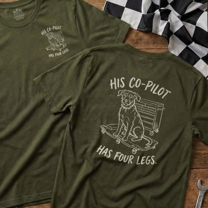 Green t-shirt with dog on skateboard graphic and text "His Co-Pilot Has Four Legs."