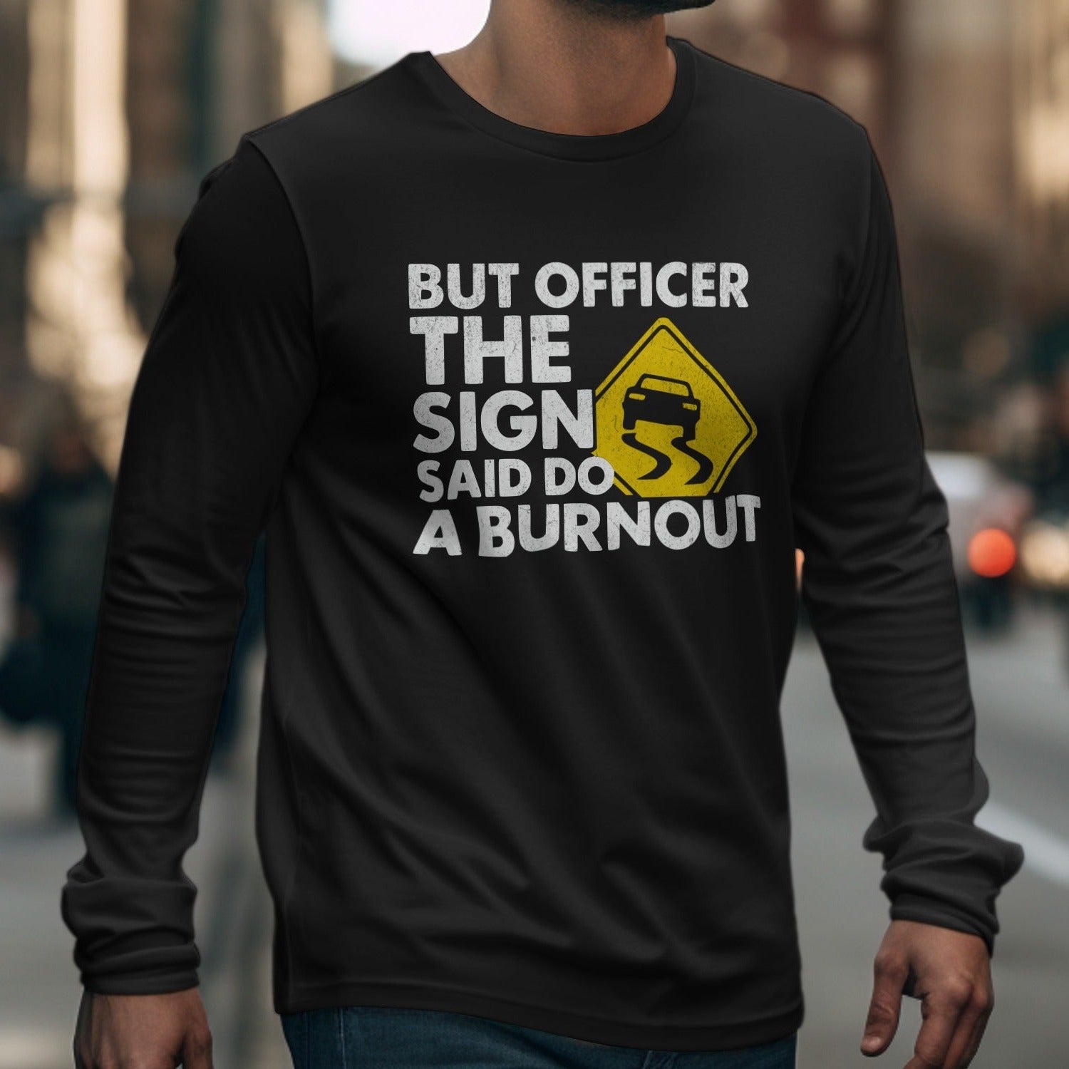 Black long sleeve shirt with white text and yellow slippery road sign.
