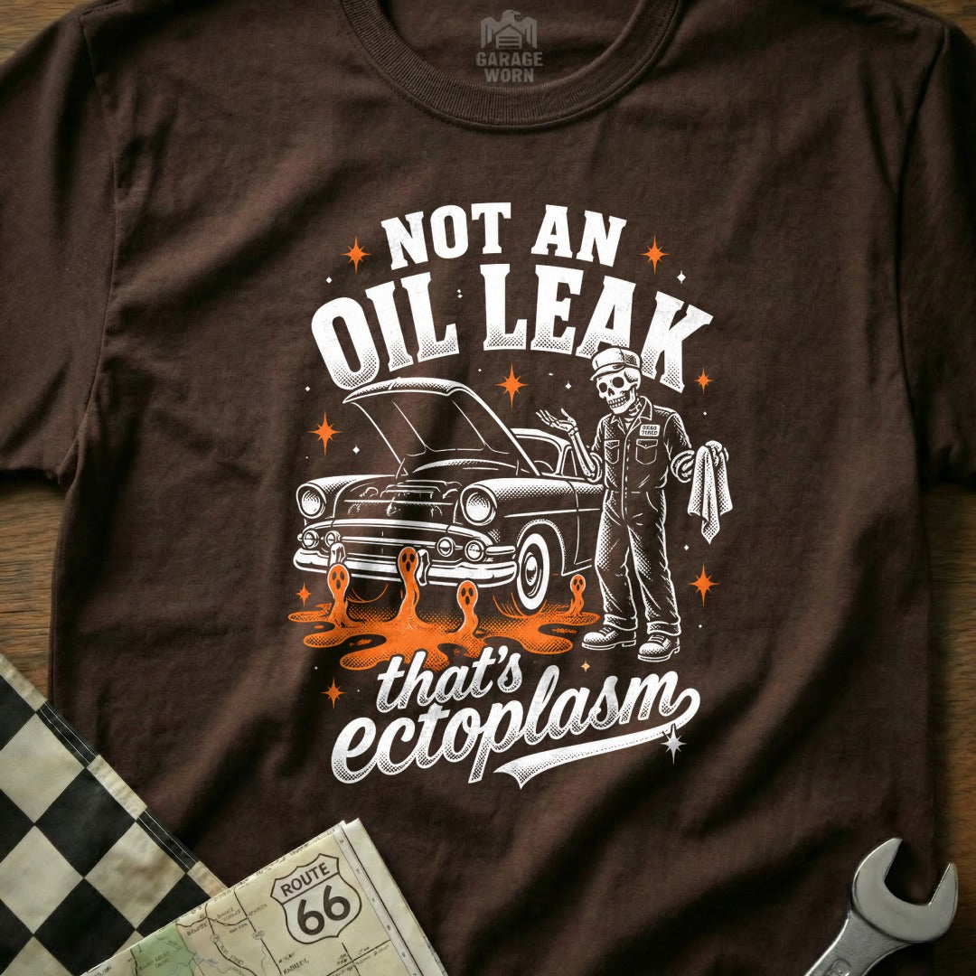 Skeleton mechanic next to car with "Not an oil leak that's ectoplasm" text.