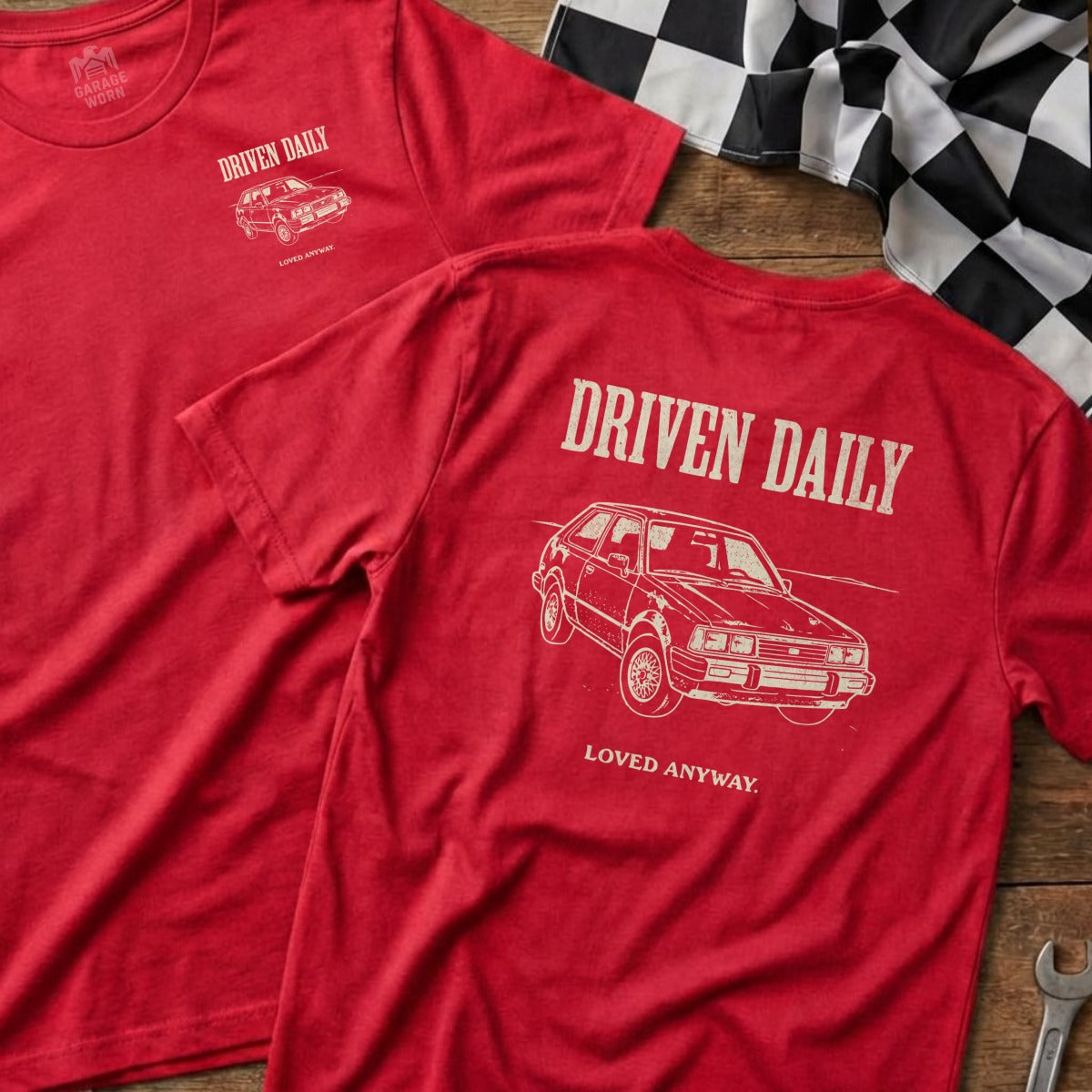 Red t-shirt with "DRIVEN DAILY" and car graphic on back.