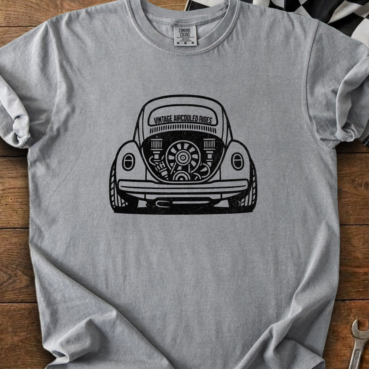 Gray t-shirt with black graphic of a vintage Volkswagen Beetle engine with "Vintage Aircooled Rides" text.