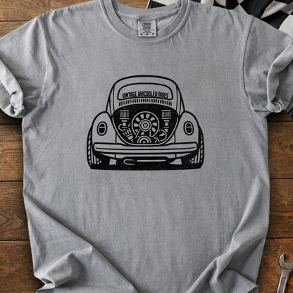 Gray t-shirt with black graphic of a vintage Volkswagen Beetle engine with "Vintage Aircooled Rides" text.