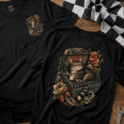 Black t-shirt featuring a tabby cat resting in a toolbox with tools and floral accents.