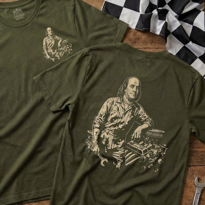 Green t-shirt with Benjamin Franklin graphic and tools on engine.