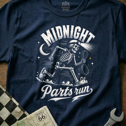 Navy t-shirt with white graphic of a running skeleton in a headlamp, text "MIDNIGHT" and "Parts run".