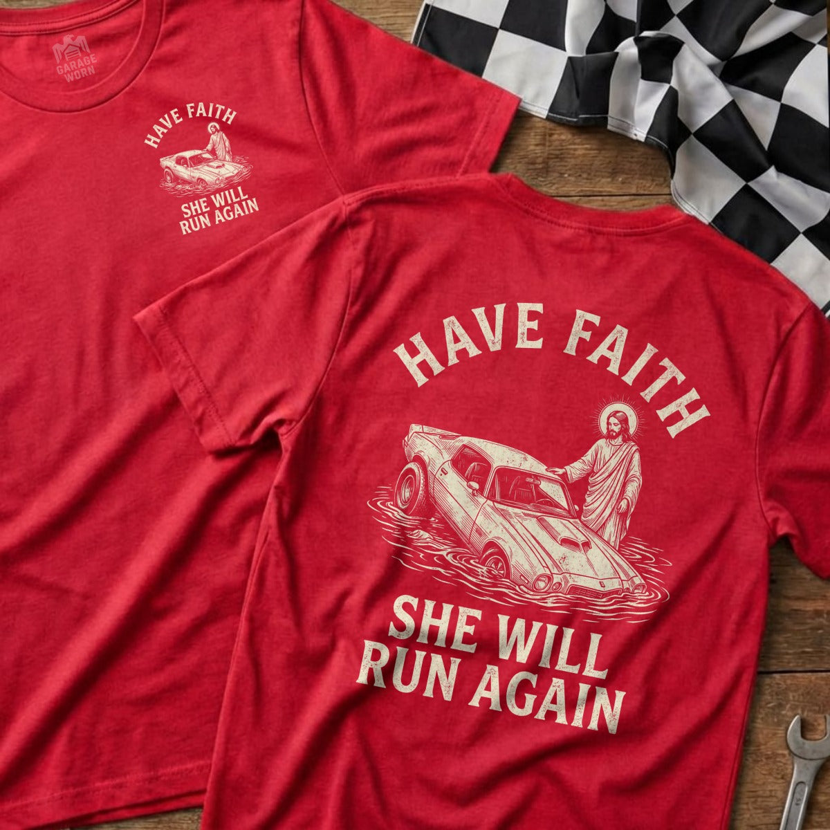 Red t-shirt with graphic of Jesus pulling a classic car from water.