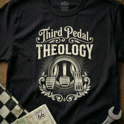 Black t-shirt with "Third Pedal Theology" text and clutch, brake, and gas pedals design.