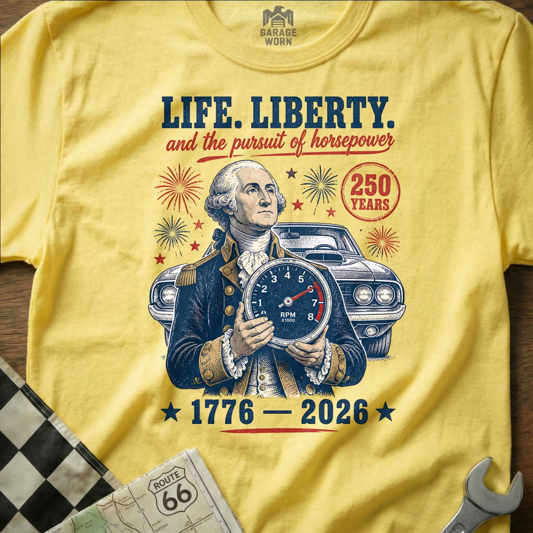 George Washington holds a tachometer, with a classic car and "Life, Liberty, and the pursuit of horsepower" text.