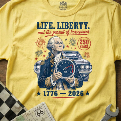 George Washington holds a tachometer, with a classic car and "Life, Liberty, and the pursuit of horsepower" text.