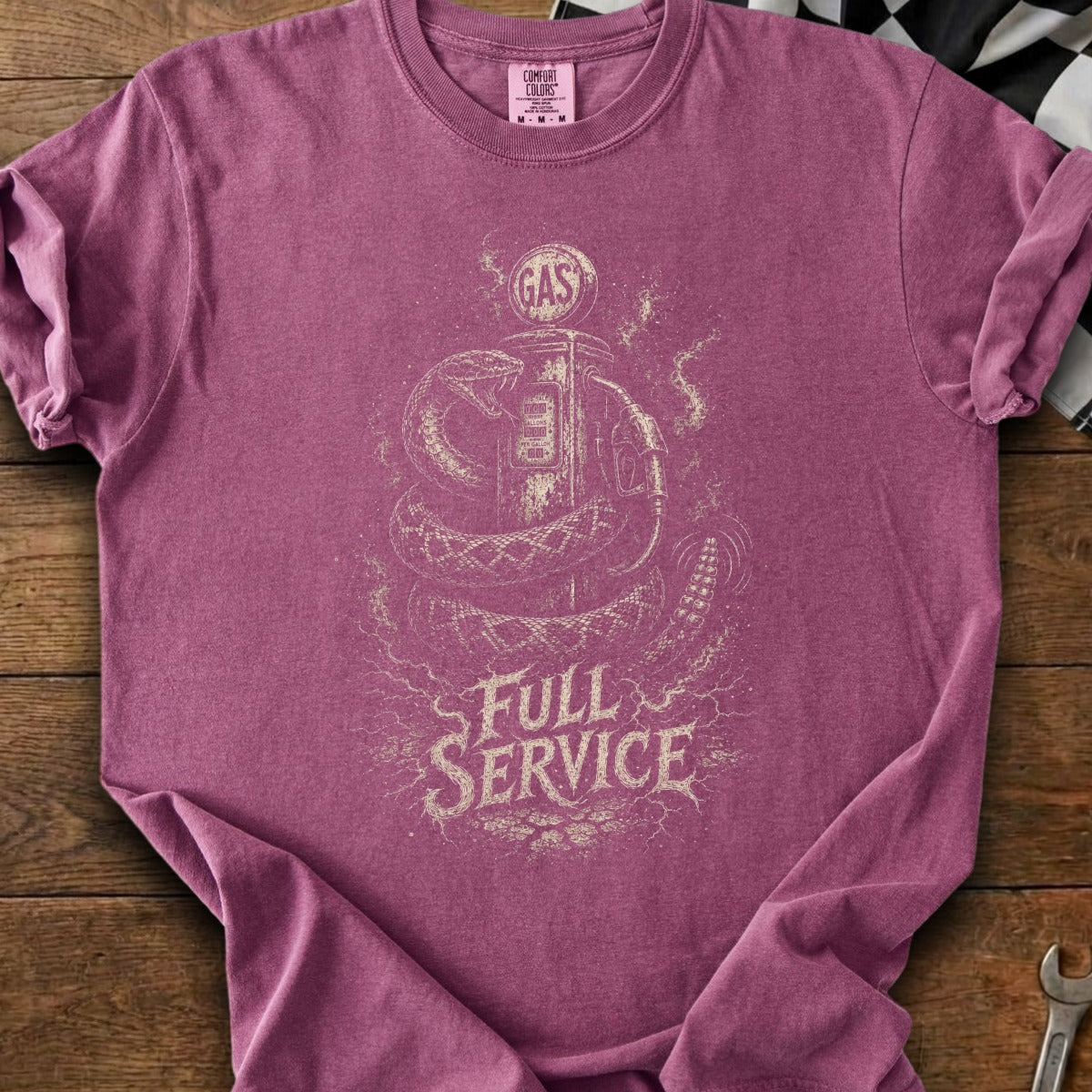 A snake coils around a gas pump with "Full Service" text.