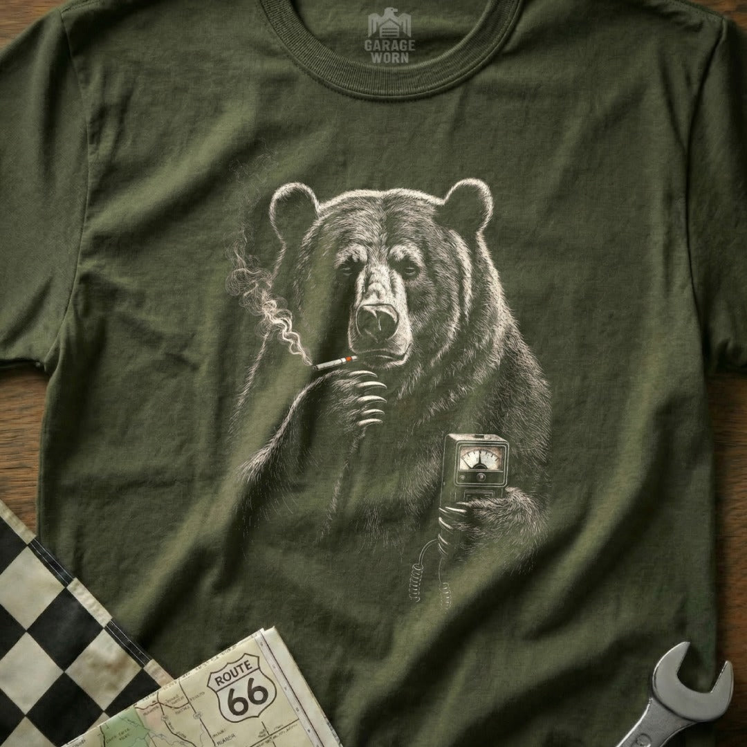 Bear smoking cigarette holding gauge on olive green t-shirt.