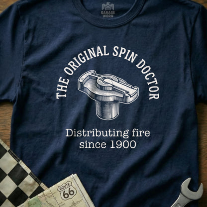 Navy t-shirt with "The Original Spin Doctor Distributing fire since 1900" and a car distributor cap graphic.