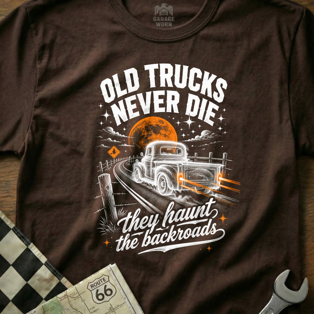 Brown t-shirt with "Old Trucks Never Die" and a vintage truck on a road.