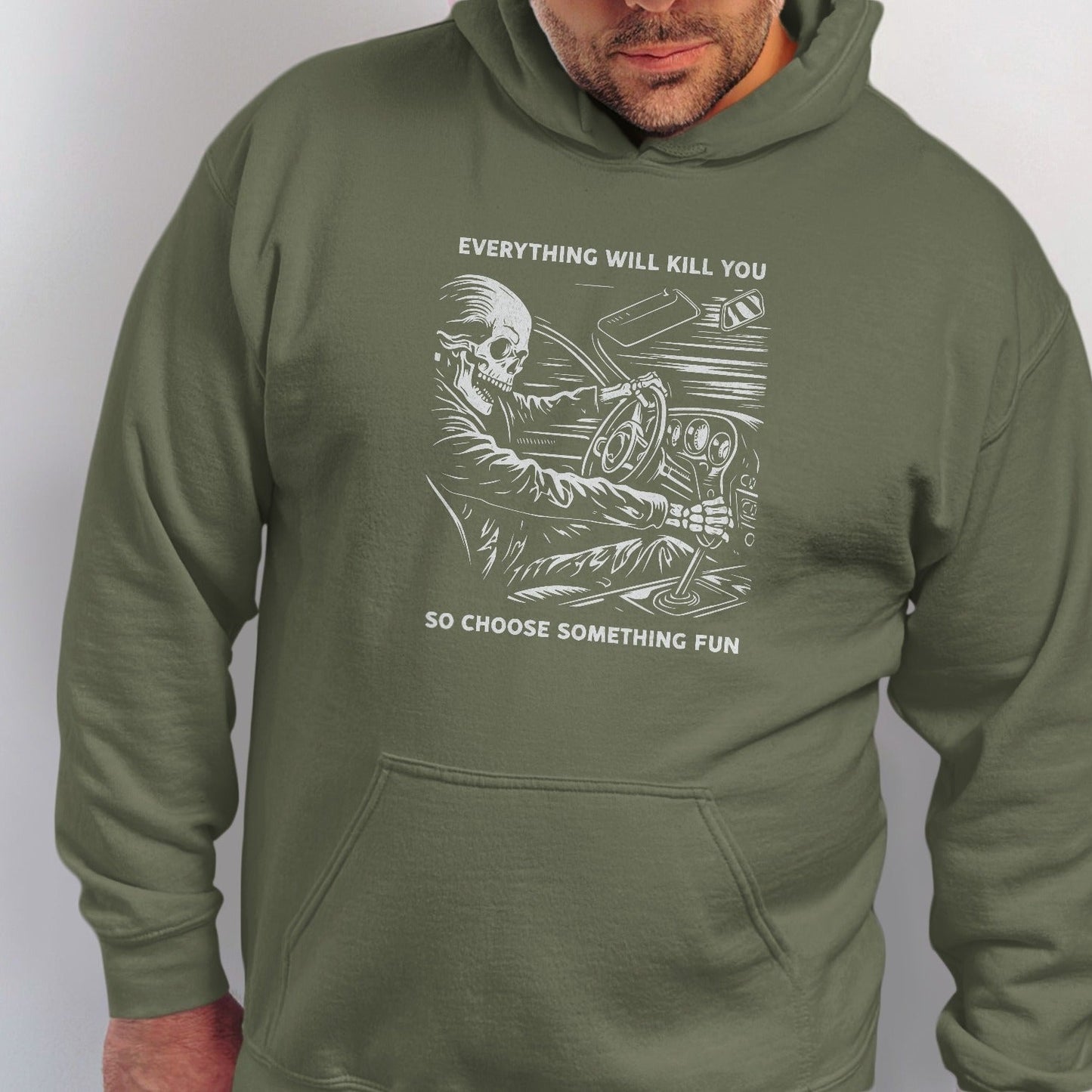 Green hoodie with a skeletal driver and the text "Everything will kill you. So choose something fun."