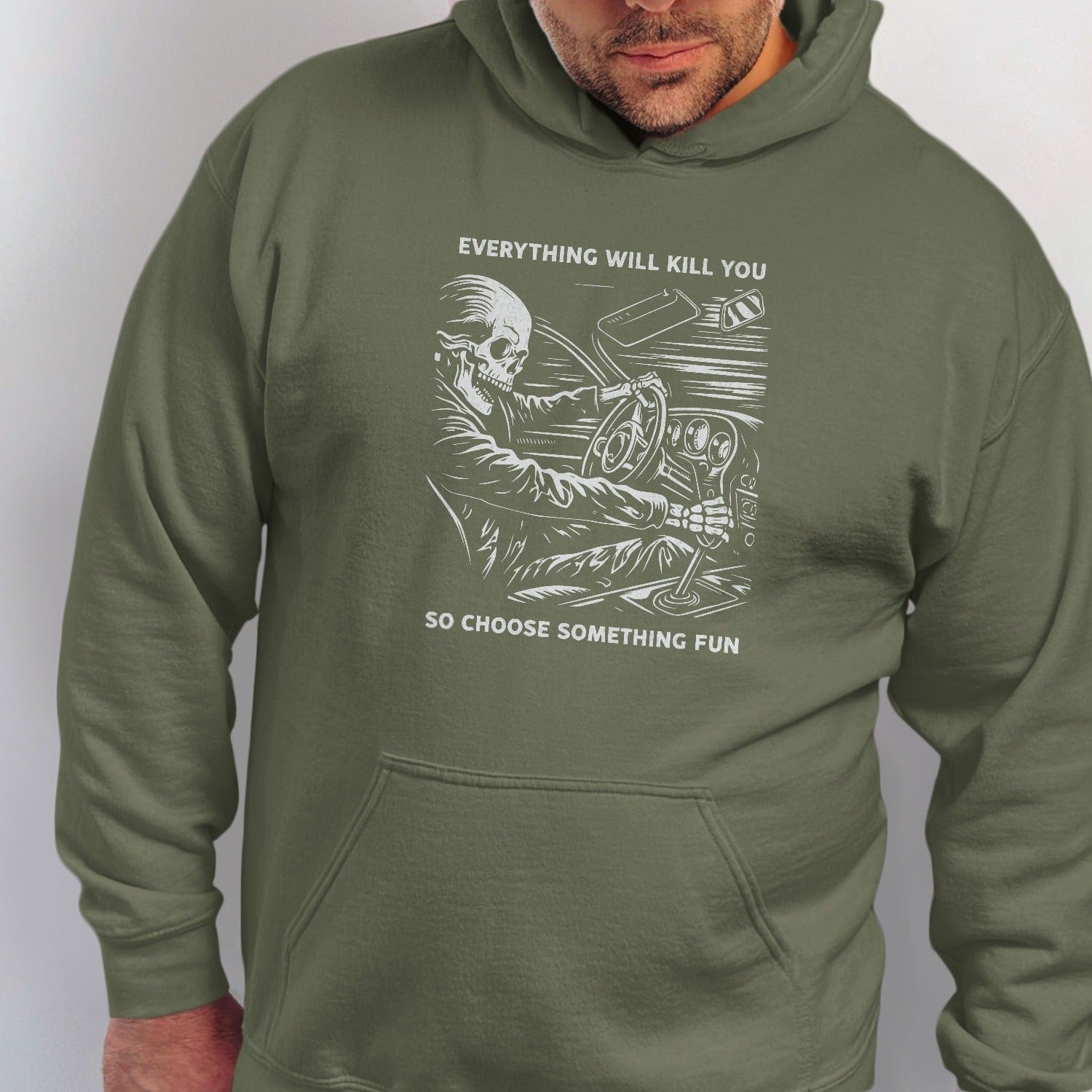 Green hoodie with a skeletal driver and the text "Everything will kill you. So choose something fun."