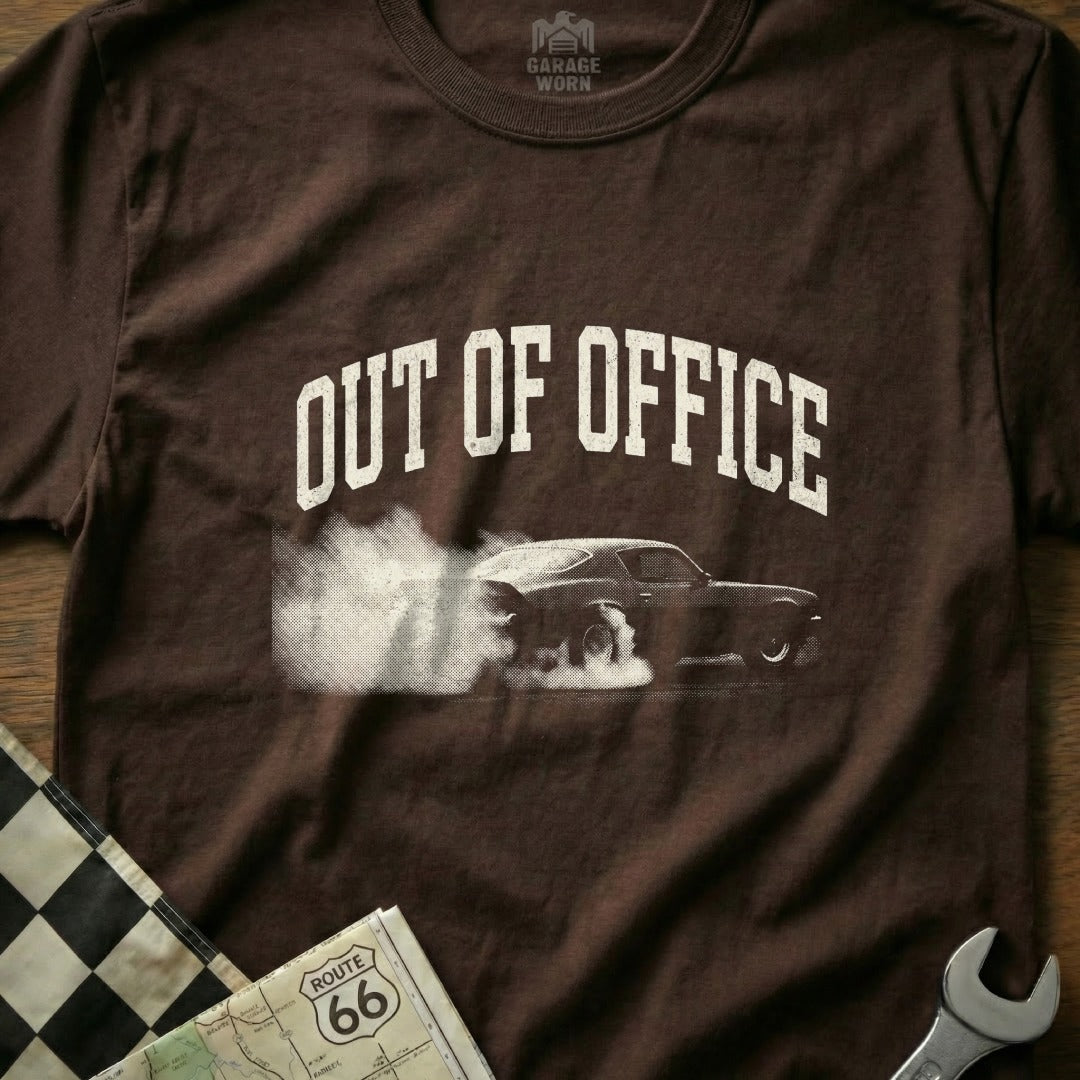Brown t-shirt with "OUT OF OFFICE" text and a car doing a burnout.