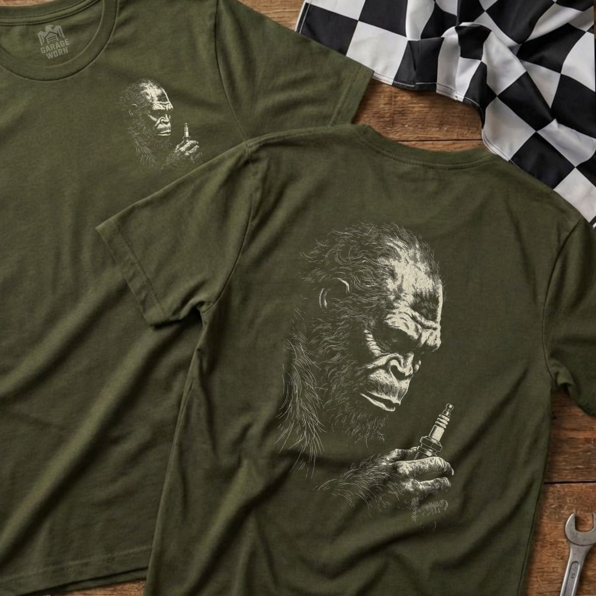Green t-shirt with ape holding spark plug, "Garage Born" logo.