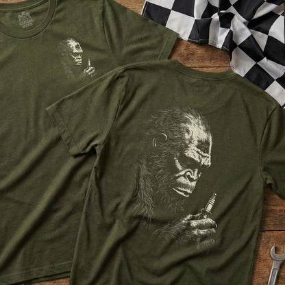 Green t-shirt with ape holding spark plug, "Garage Born" logo.