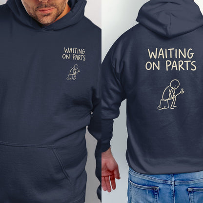 Navy hoodie with "WAITING ON PARTS" text and stick figure graphic.