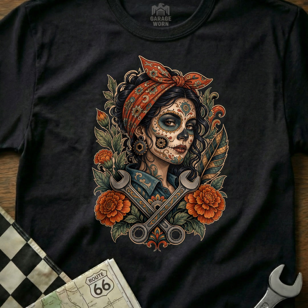 Dia de los Muertos woman with wrenches and marigolds on a black t-shirt.