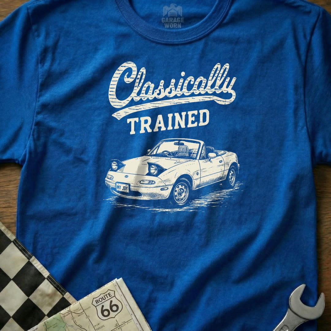 Blue t-shirt with "Classically TRAINED" and illustration of a white convertible Mazda Miata.