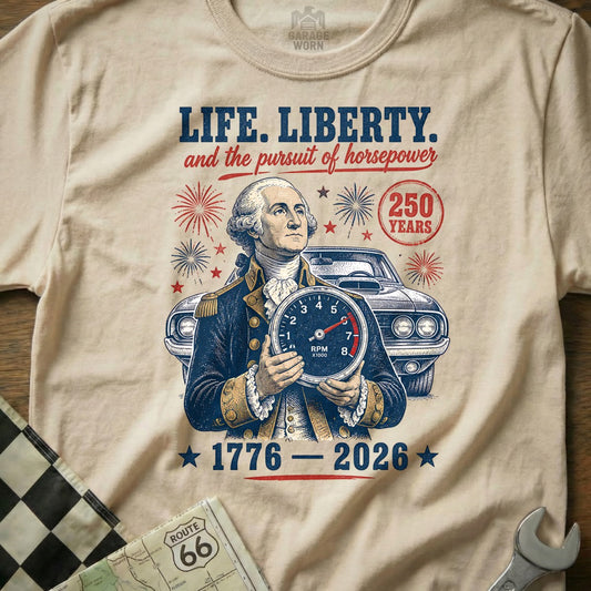 George Washington holds a speedometer with "LIFE. LIBERTY. and the pursuit of horsepower" and "1776-2026" text.