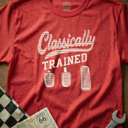 Red t-shirt with "Classically TRAINED" text and car pedals graphic.
