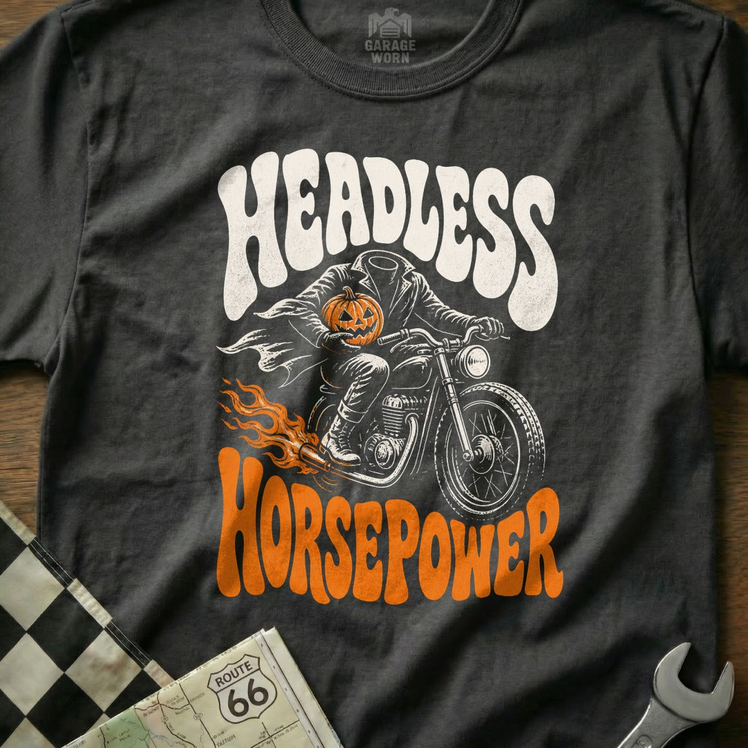 Black t-shirt with "Headless Horsepower" Halloween graphic featuring a headless rider holding a pumpkin on a motorcycle.