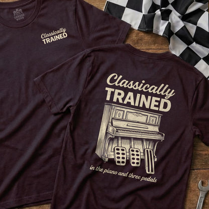 Maroon t-shirt featuring a piano and three pedals with "Classically Trained" text.