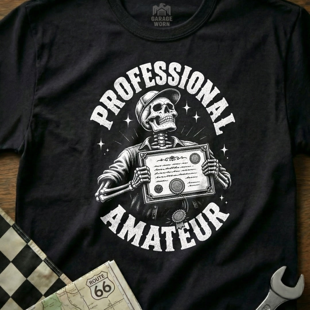 Black t-shirt with skeleton wearing a hat holding a certificate, text Professional Amateur.