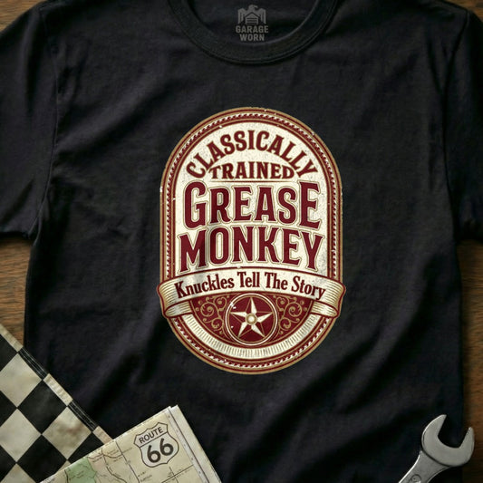 Black t-shirt with oval logo reading "Classically Trained Grease Monkey Knuckles Tell The Story".