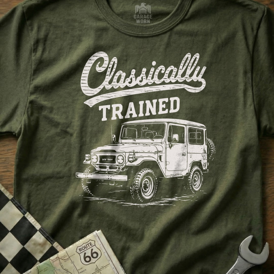 Green t-shirt with white graphic of a classic Toyota Land Cruiser and text "Classically TRAINED".