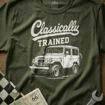Green t-shirt with white graphic of a classic Toyota Land Cruiser and text "Classically TRAINED".