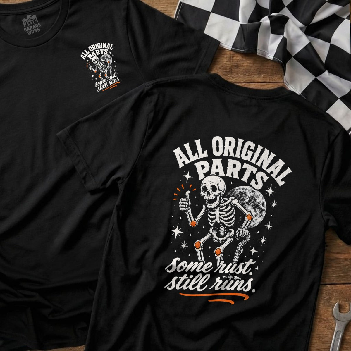Black t-shirt with skeleton giving thumbs up and text "All Original Parts. Some rust. Still runs."