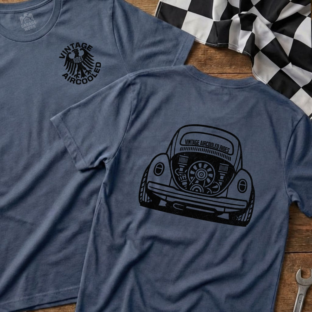 Blue t-shirt with black vintage air-cooled VW Beetle graphic on back.