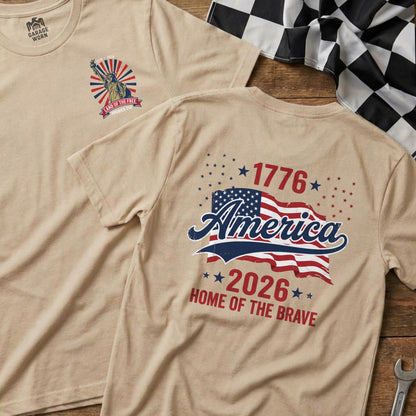 Tan t-shirt with "America 1776-2026 Home of the Brave" graphic.