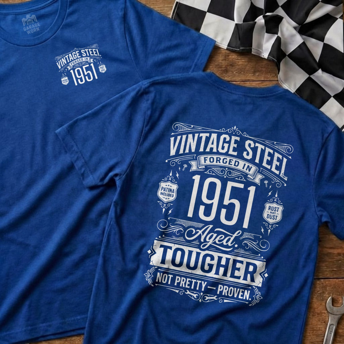 Blue t-shirt with "Vintage Steel 1951 Aged Tougher Not Pretty-Proven" text.