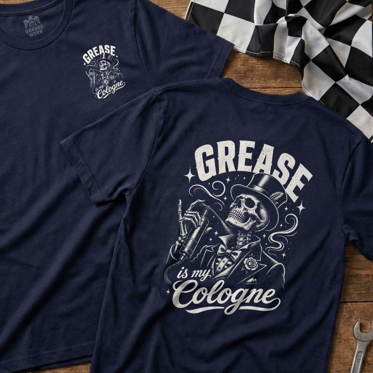 Navy t-shirt featuring a skeleton in a suit spraying "Grease is my Cologne" on the back.