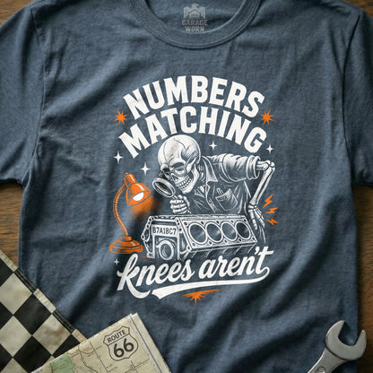 Skeleton mechanic examines engine block with magnifying glass, "Numbers matching knees aren't" text.