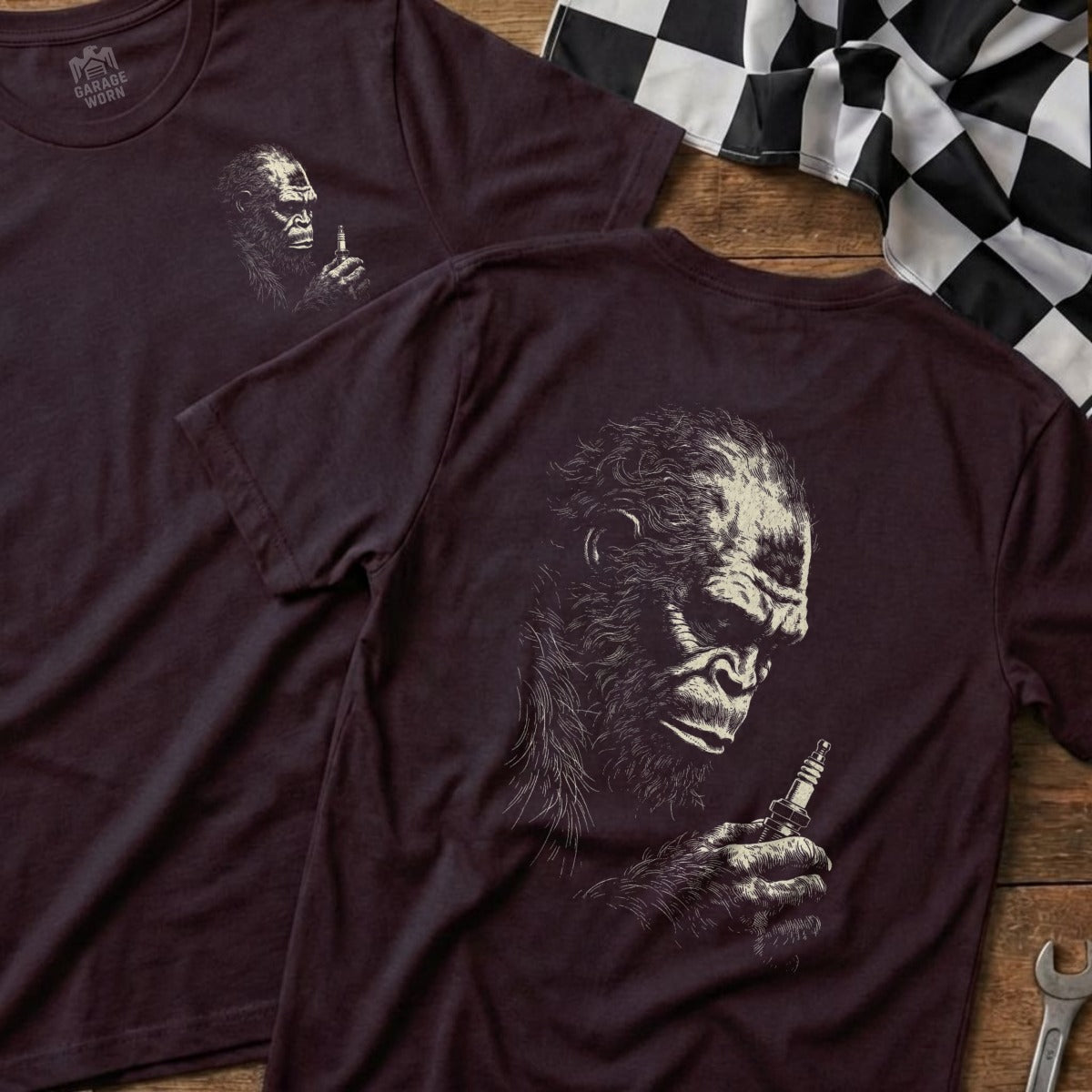 T-shirt with a sketch of a gorilla holding a spark plug.