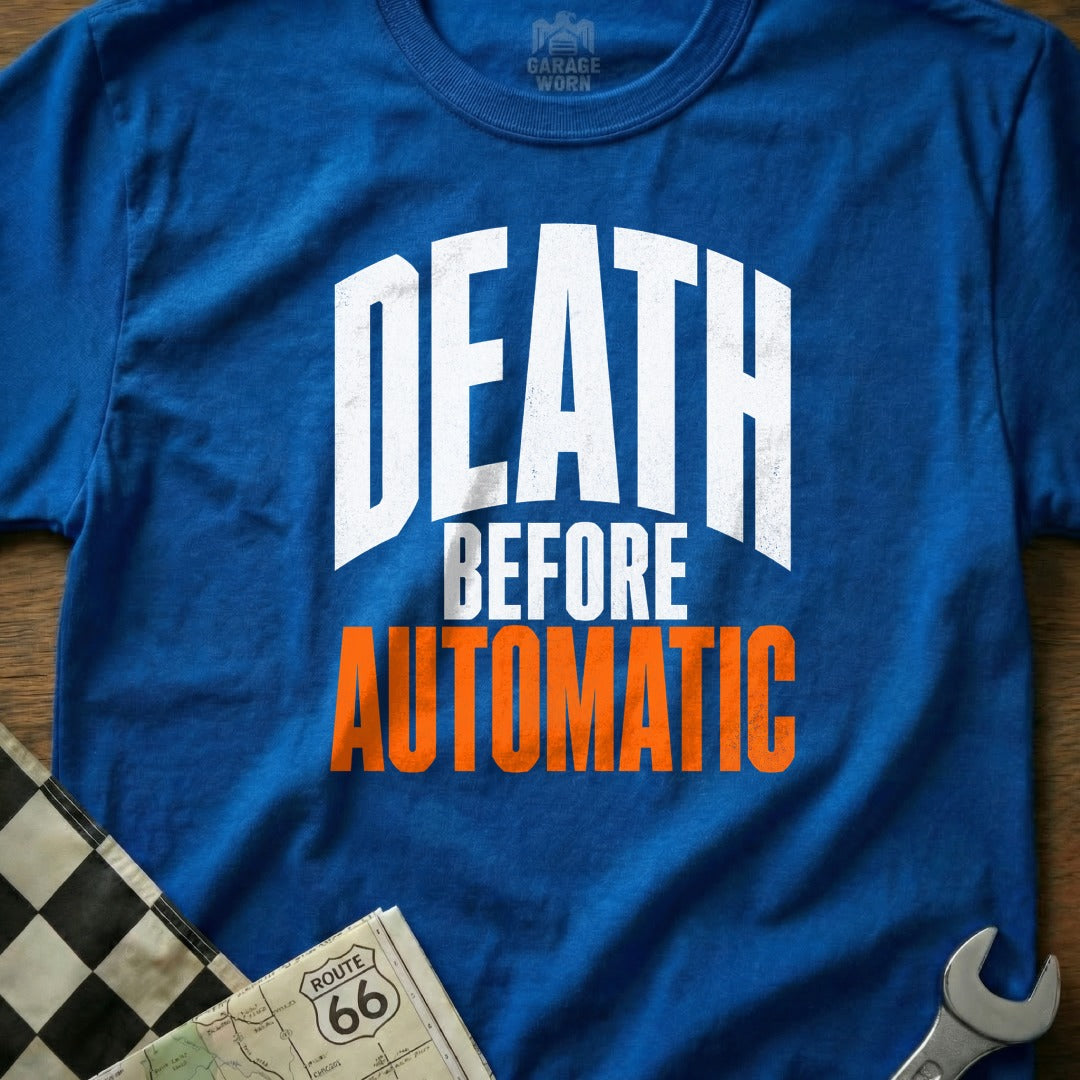 Blue t-shirt with white text "DEATH BEFORE AUTOMATIC" and a "GARAGE WORN" logo.