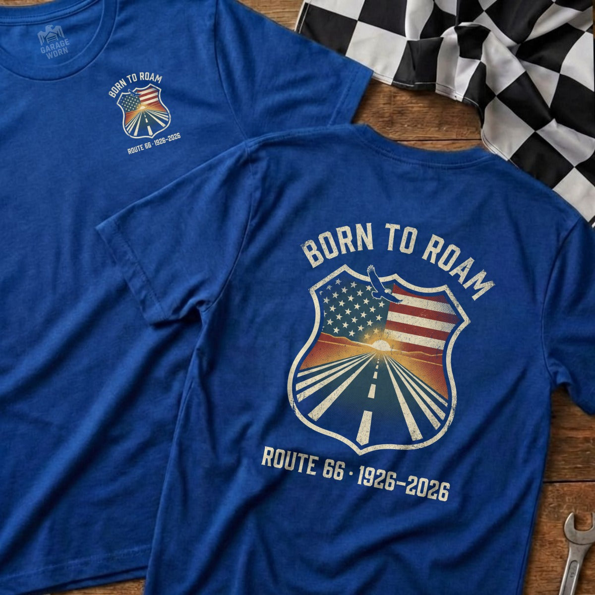 Blue t-shirt with "Born to Roam" shield graphic and Route 66 imagery.