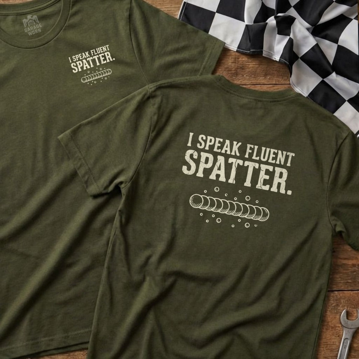 Green t-shirt with "I SPEAK FLUENT SPATTER" and welding tip design.