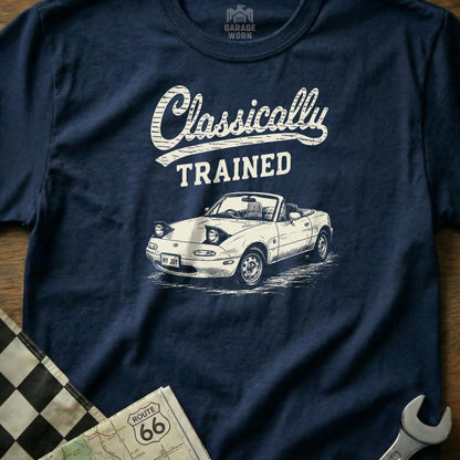 Navy t-shirt with white "Classically TRAINED" text and a white convertible car illustration.