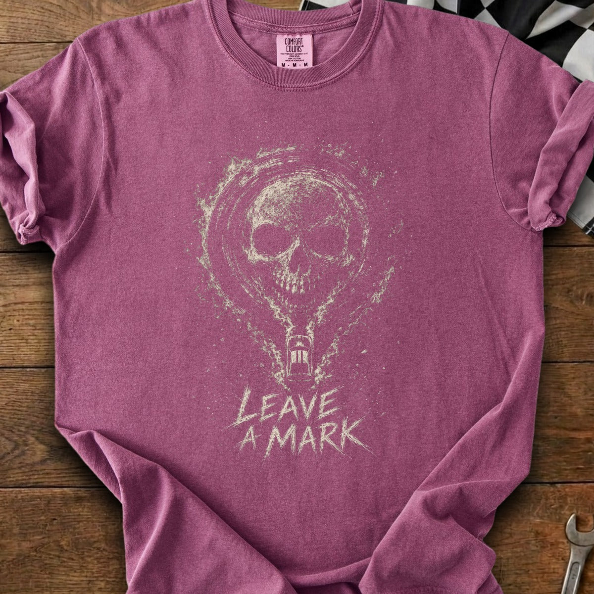 Plum t-shirt with a distressed skull graphic and "LEAVE A MARK" text.