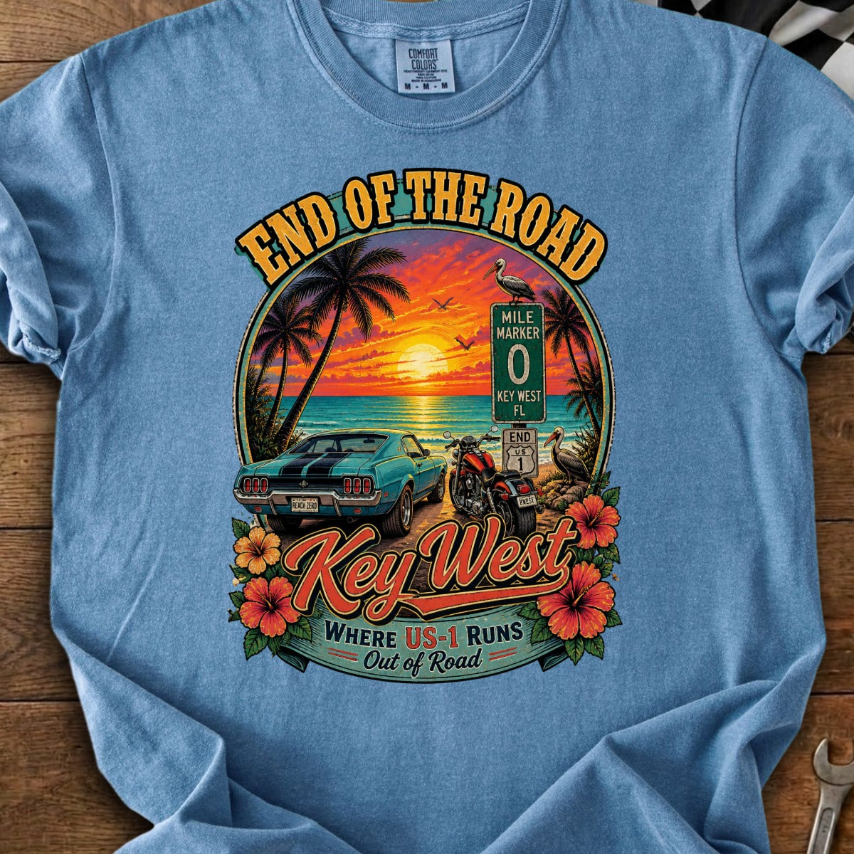 End of the Road Key West FL graphic with a car, motorcycle, and sunset.