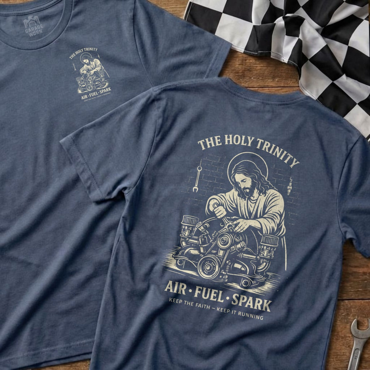 Two blue t-shirts with "The Holy Trinity Air Fuel Spark" graphic.