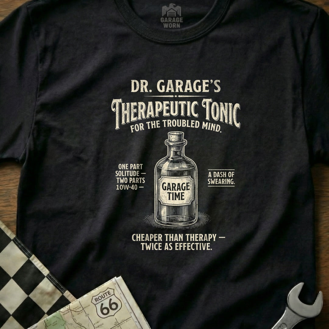 Black t-shirt with "Dr. Garage's Therapeutic Tonic" design featuring a bottle and automotive text.