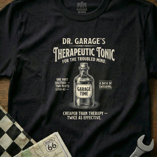 Black t-shirt with "Dr. Garage's Therapeutic Tonic" design featuring a bottle and automotive text.